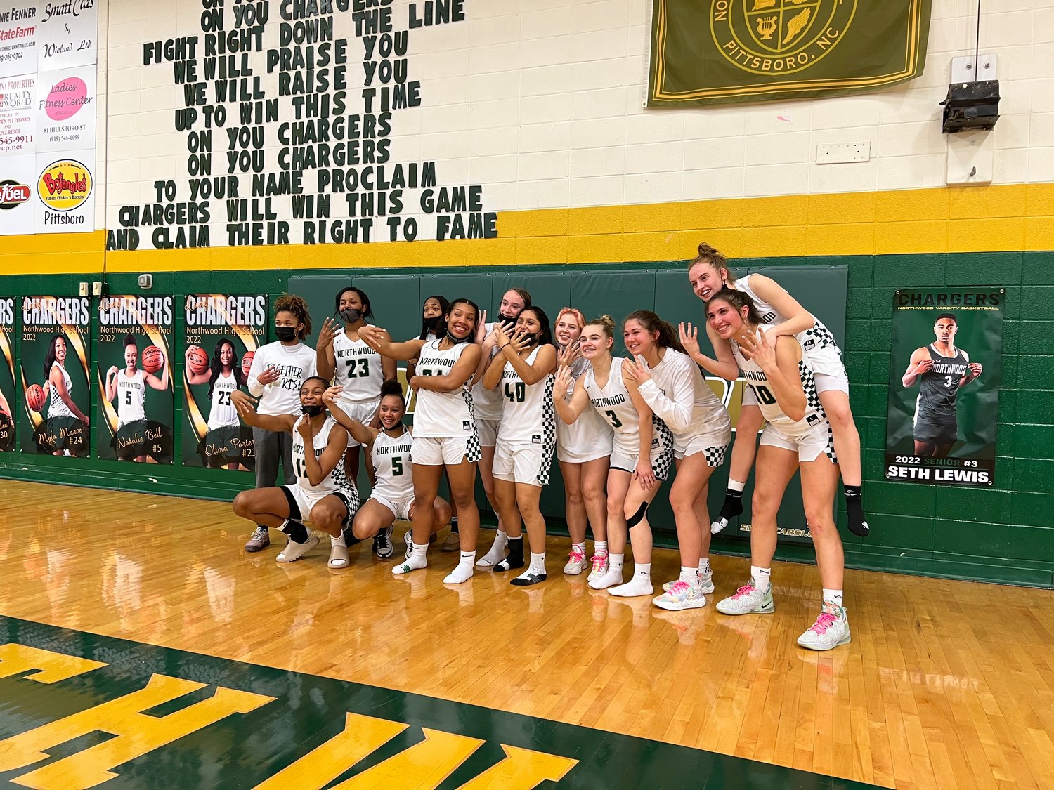 Northwood's women's basketball team poses for photos after the Chargers' 66-52 win over the Williams Bulldogs in the Elite Eight of the NCHSAA 3A playoffs on Tuesday. With the win, Northwood advanced to its second-straight Final Four.